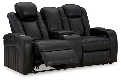 Caveman Den - Midnight - Power Reclining Loveseat with Console/ Adj Hdrst